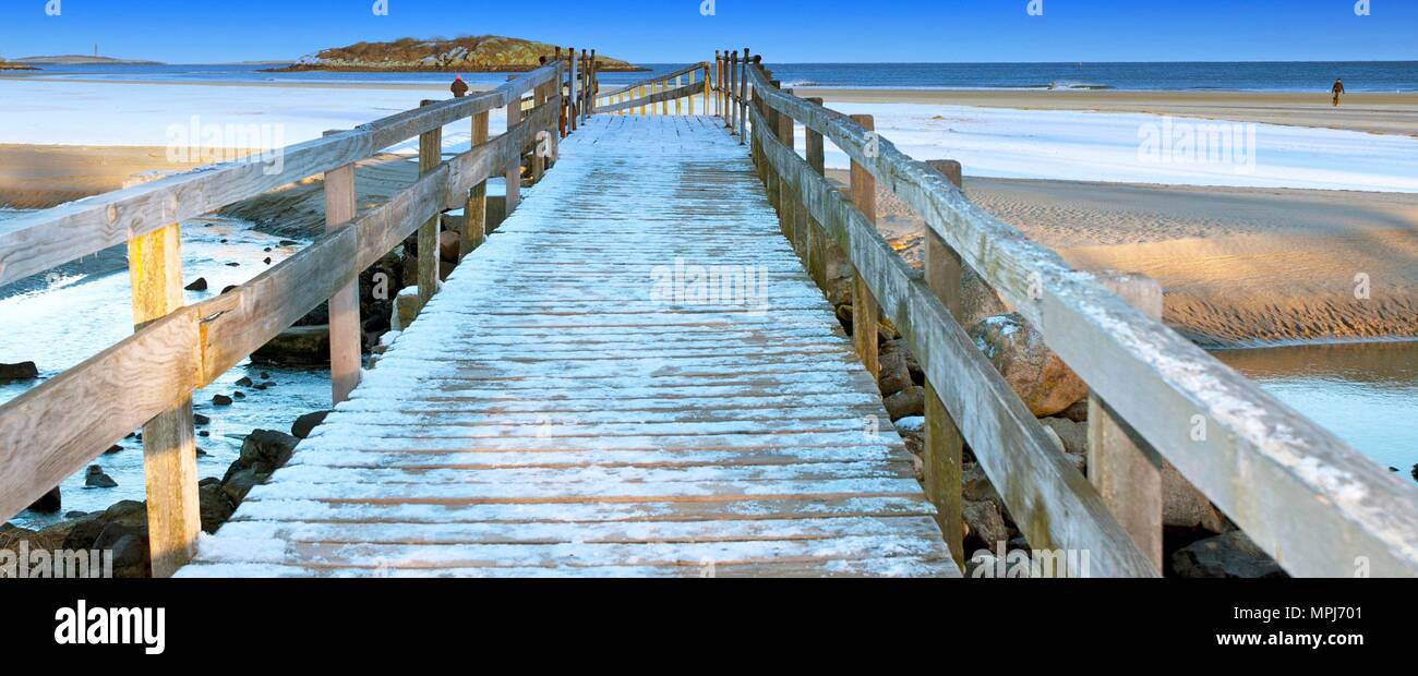 This bridge was constructed to walk over the small river to the larger beach. Stock Photo