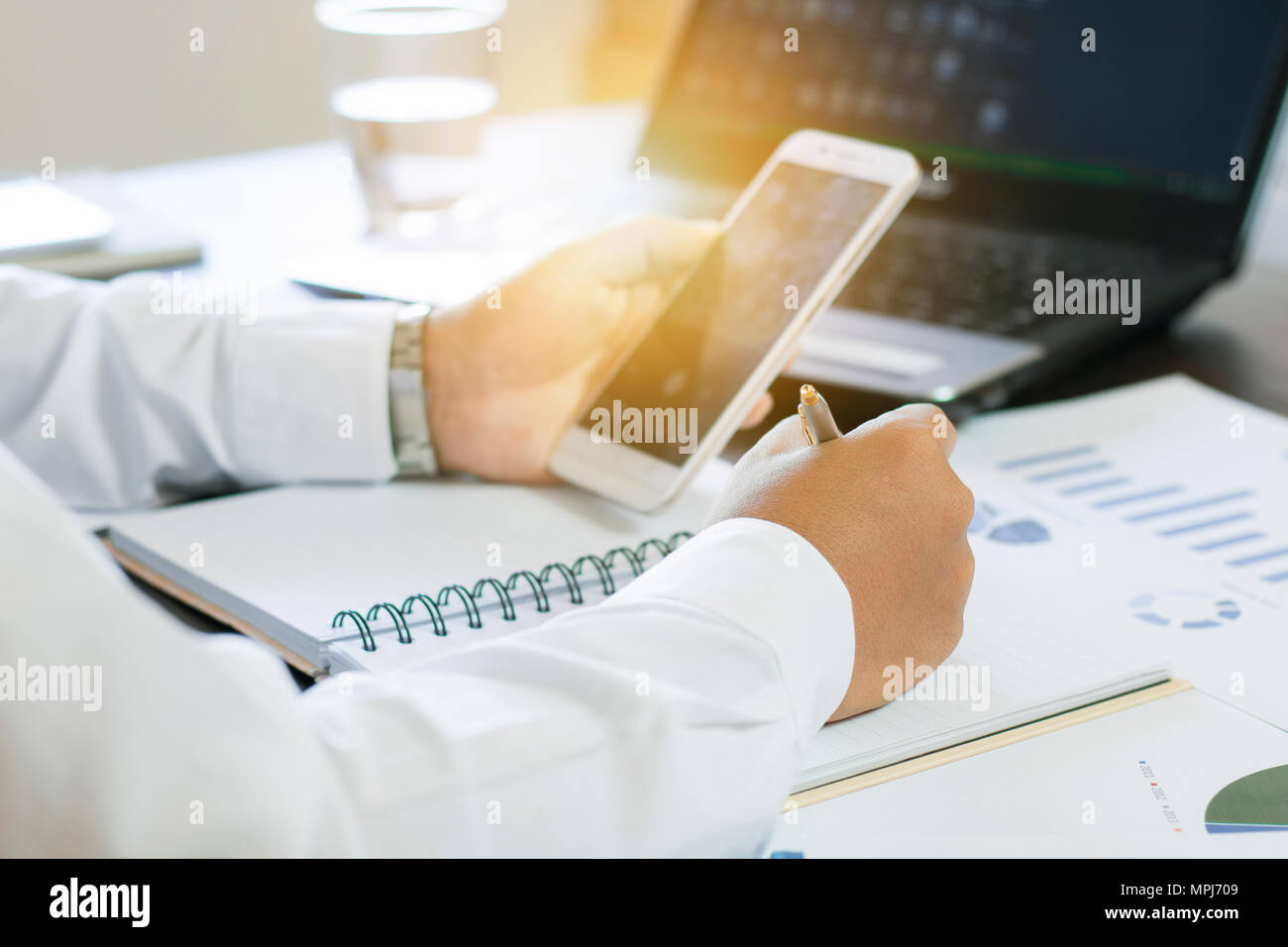 Businessman writing on paper chart hi-res stock photography and images ...