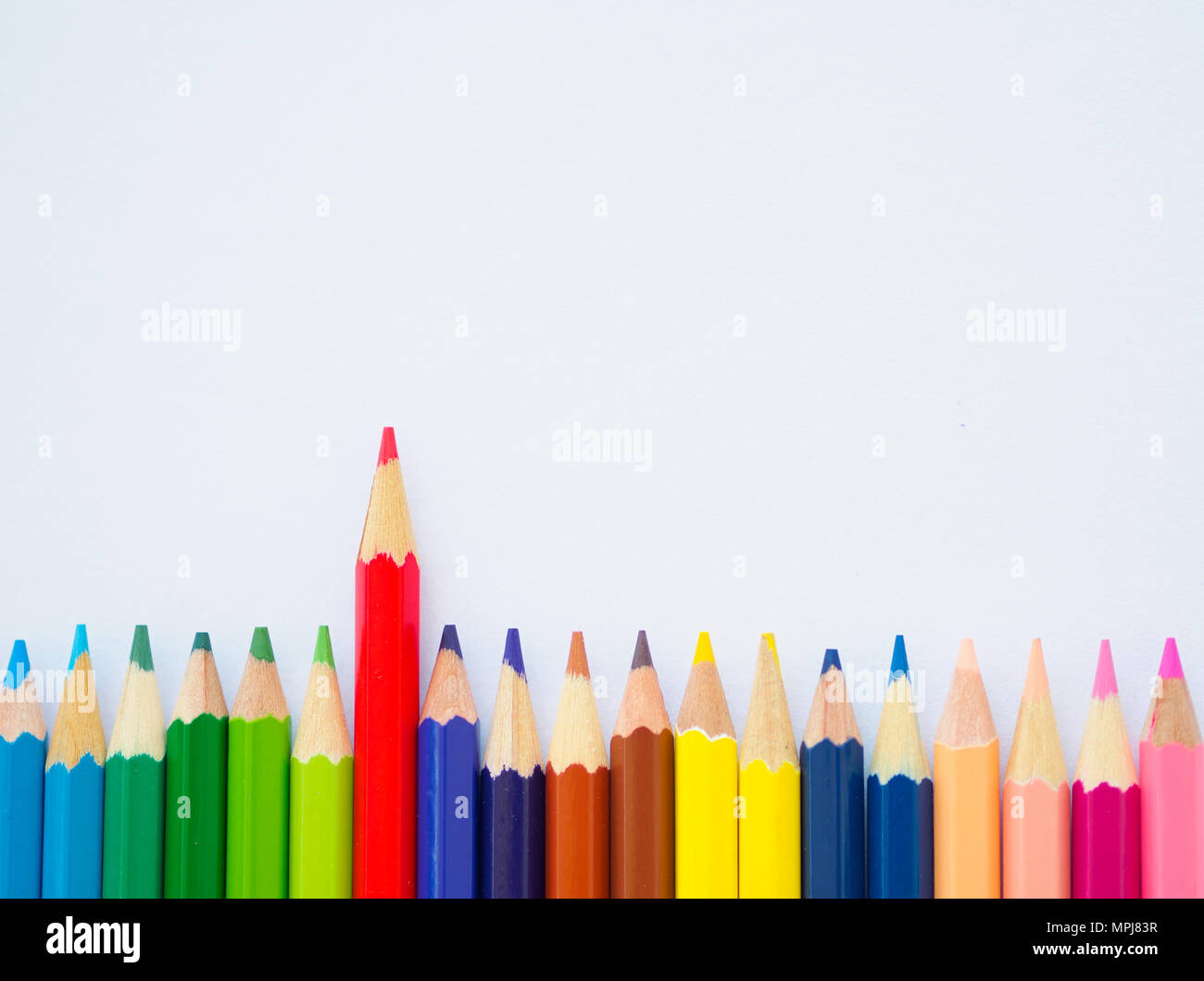 Color pencils on white paper. Education material back to school, for  background and wallpaper Stock Photo - Alamy