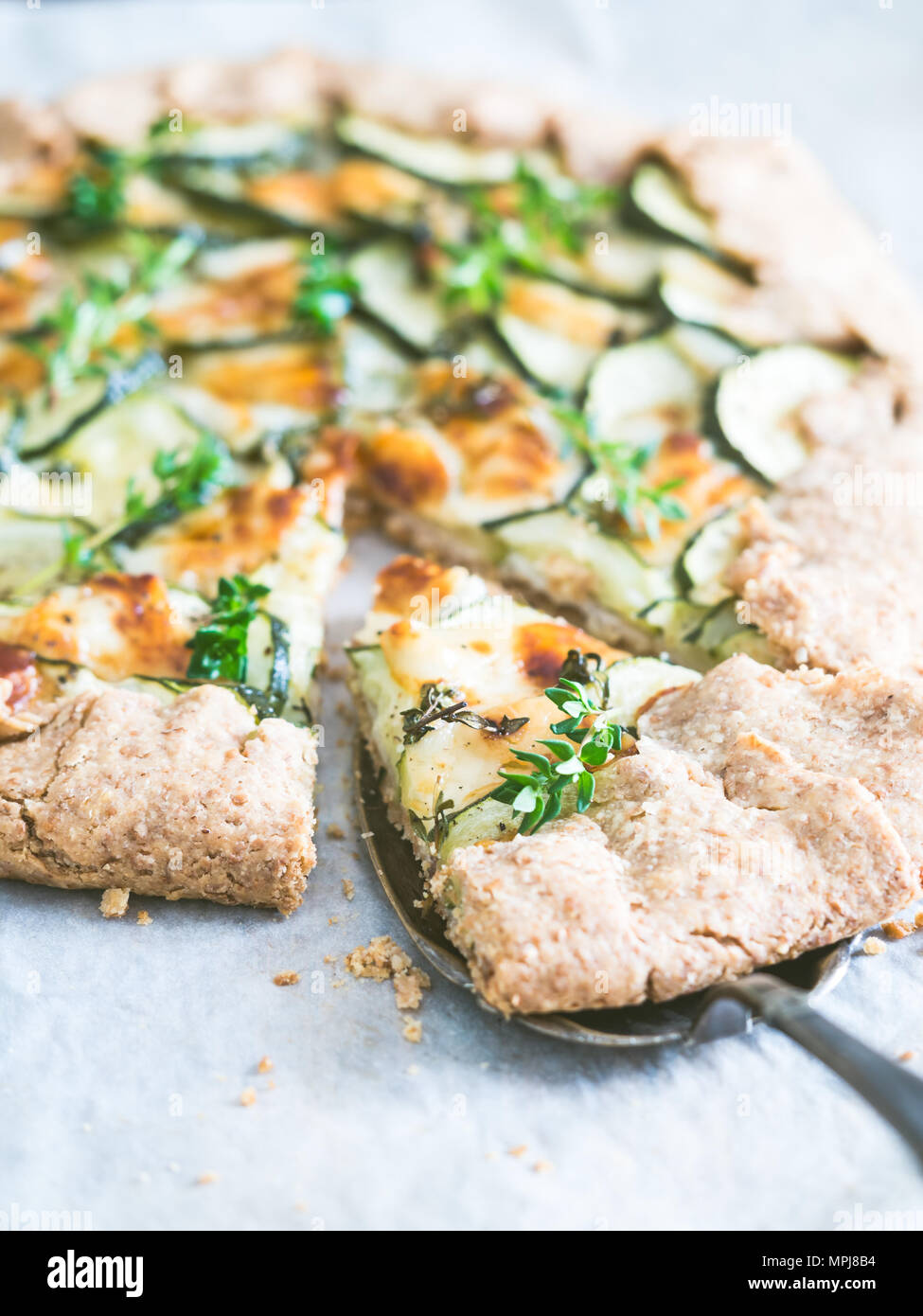 Savory zucchini and cheese galette on spelt dought, served with fresh
