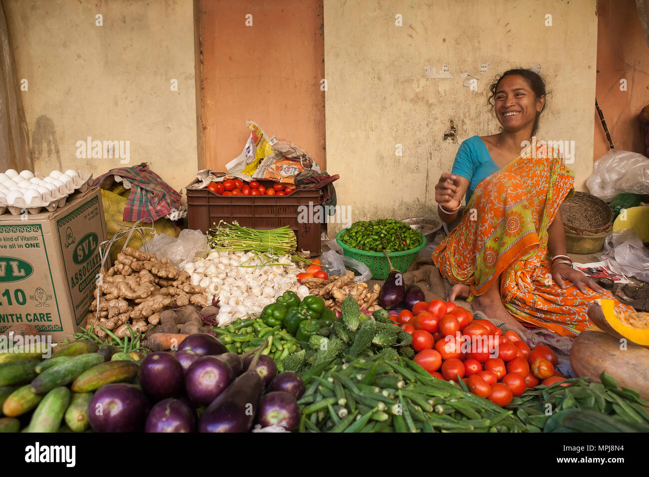 India, West Bengal, Kolkata, Vendor at the vegetable market in the Garia district. Stock Photo