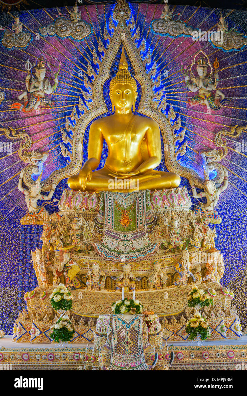 Bangkok, Thailand - July 15, 2015: Beautiful golden Buddha image with god and goddess statue decorated on wall at Pariwas temple, where is travel dest Stock Photo