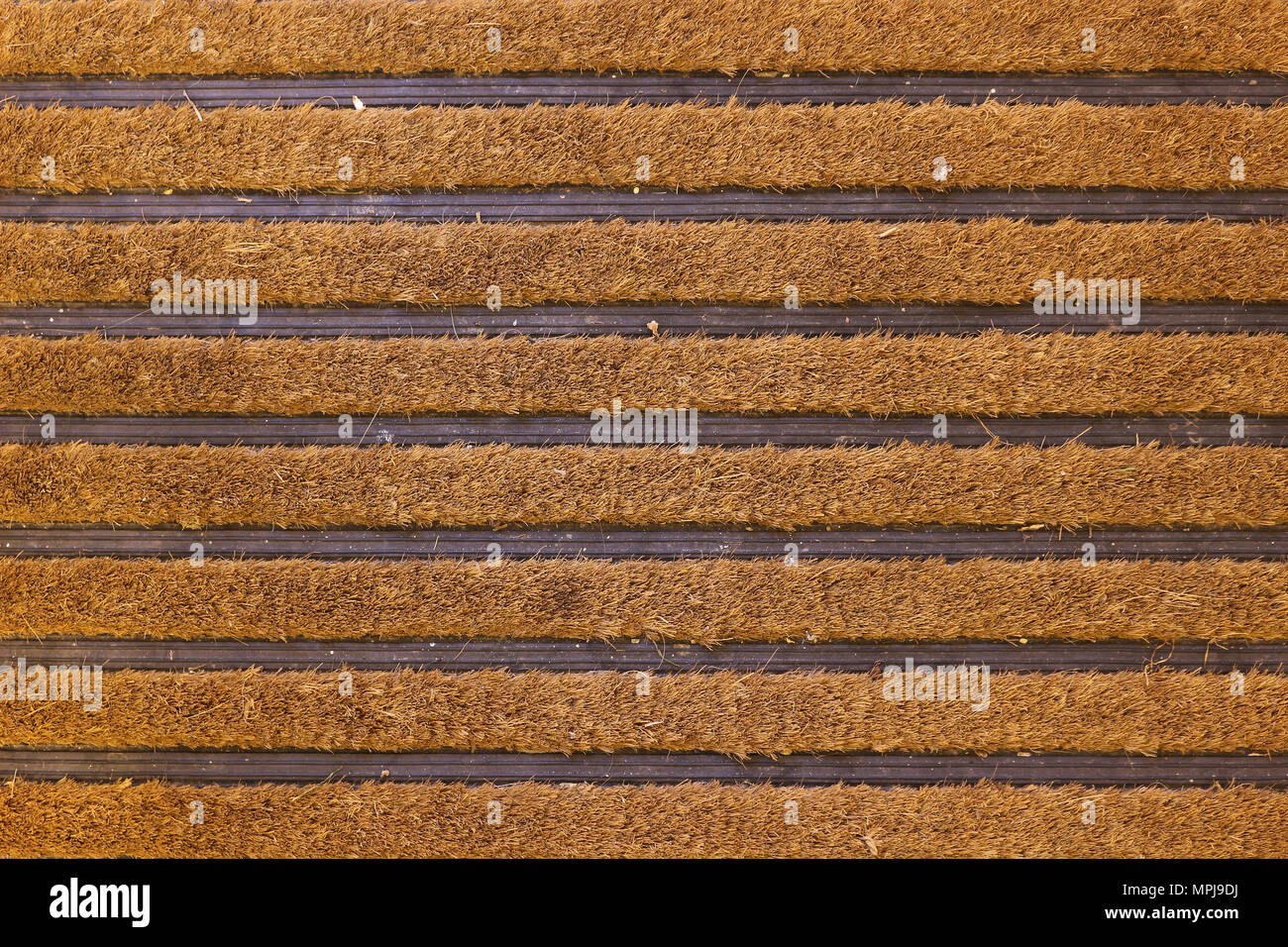 Brown coconut fibre striped door mat Stock Photo