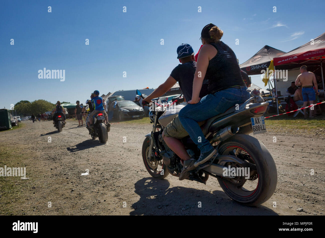 19-20th May 2018. Le Mans, France.  Behind the scenes at the MotoGP.  Campers motorcycling around the campsite on the motorcycles, where there's no need to worry about wearing crash helmets. Stock Photo