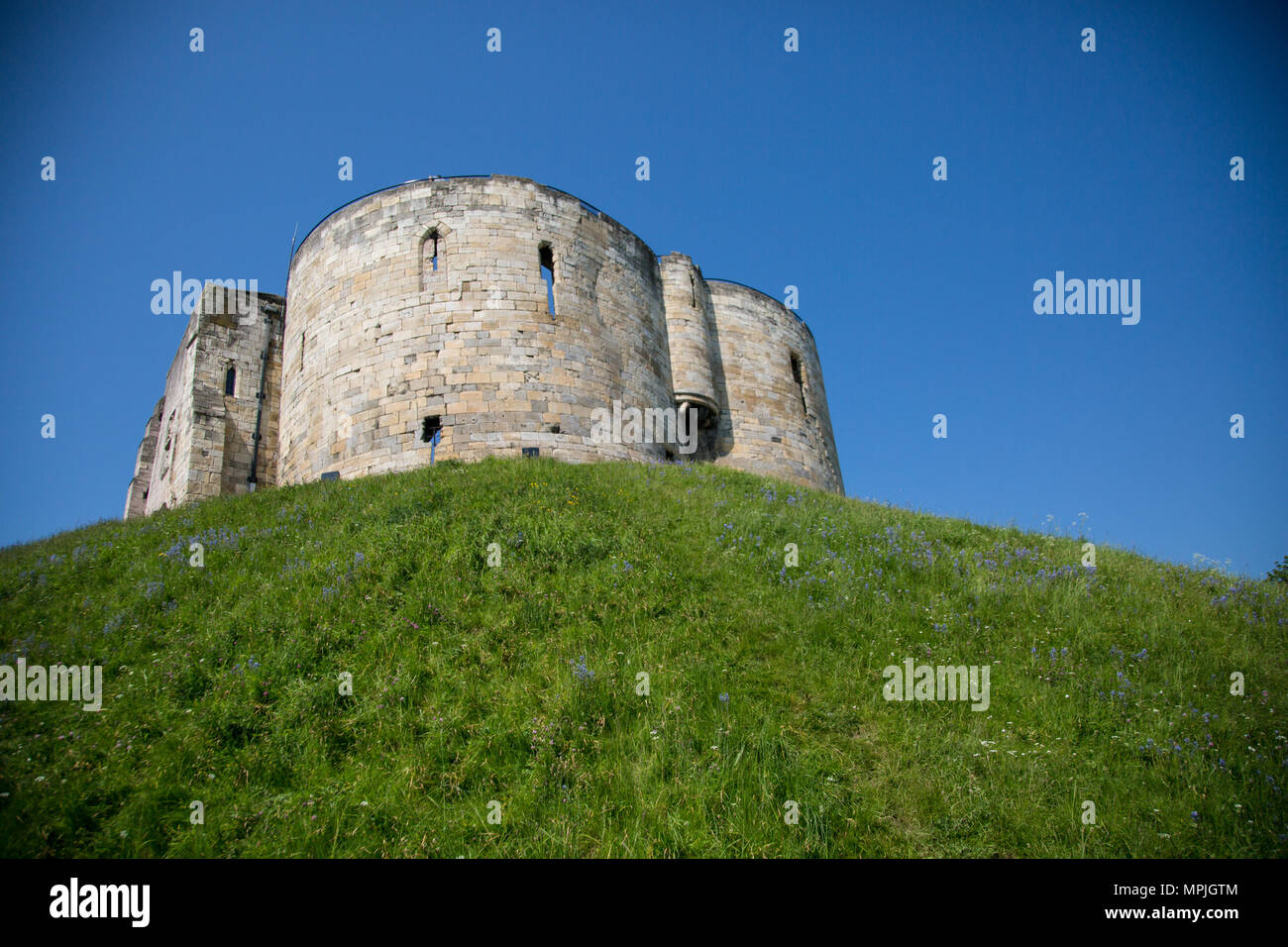Clifford's tower in the town of York in Yorkshire is all that remains of York Castle with unrivalled views of York Minster and the city of York. Stock Photo