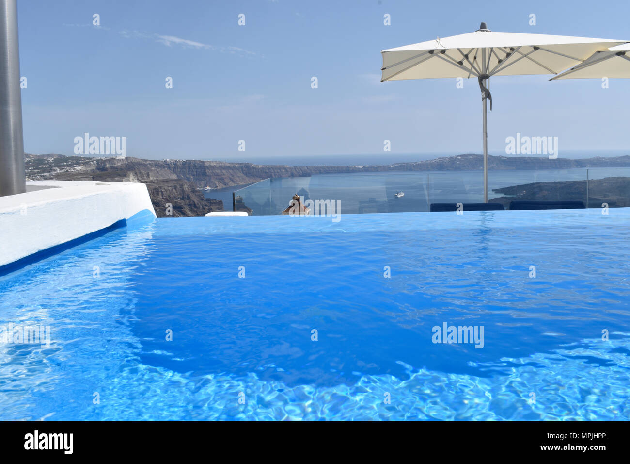 Santorini pool overlooking the Caldera in Imerovigli Stock Photo