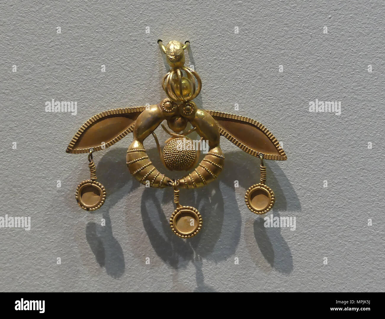 CRETE Minoan gold necklace charm showing two bees and a hive in Heraklion Museum. Photo: Tony Gale Stock Photo