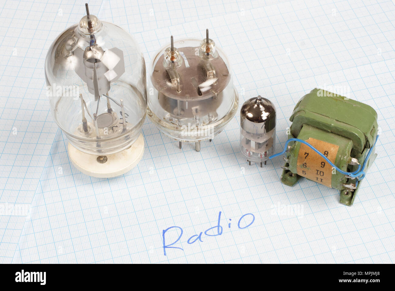 Old Vacuum Tube Electron Tube And Transformer On Graph Paper