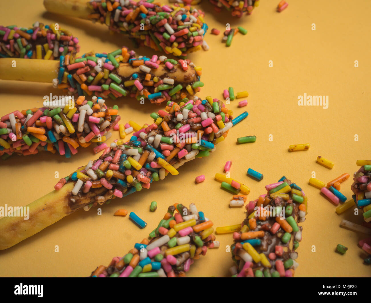 Closeup Bread Sticks with Chocolate and Colorful Topping with Space on
