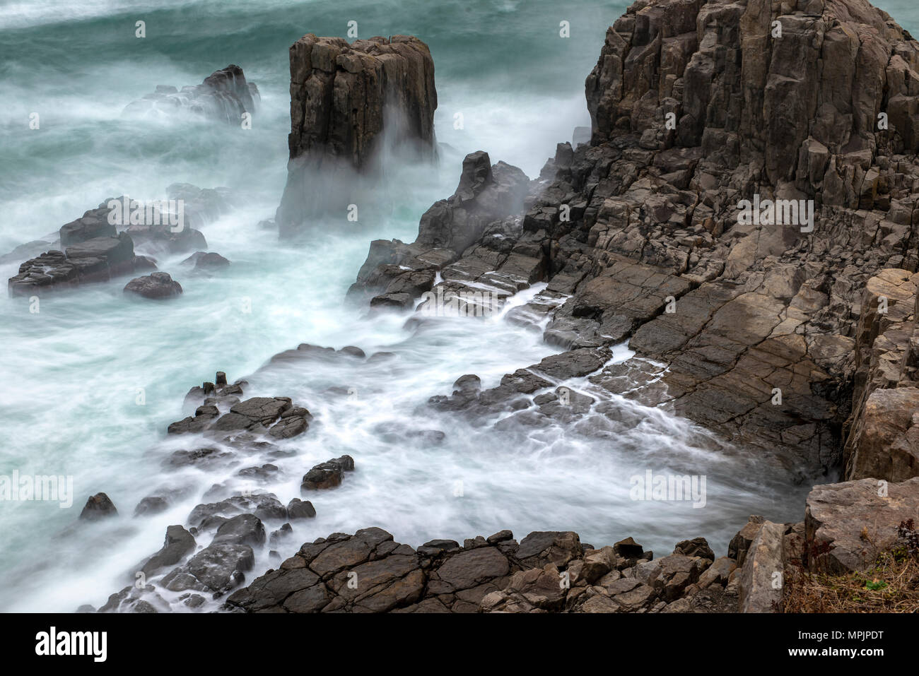 Waves hitting beach cliff sunset hi-res stock photography and images ...