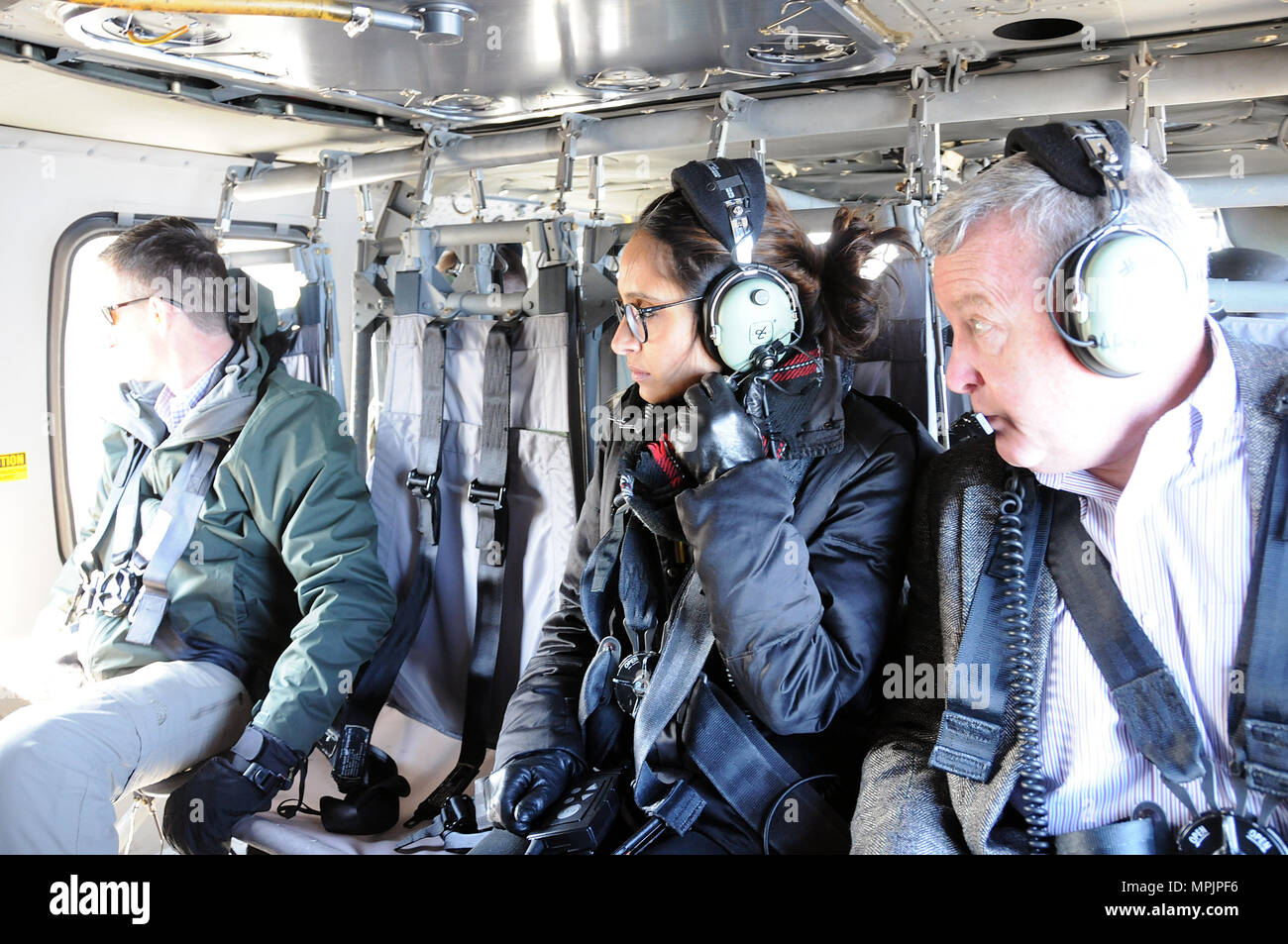 Sophia Lalani (middle), Defense and Foreign Policy advisor to U.S. Senator Cory Booker, participates in an aerial tour March 17 of Joint Base McGuire-Dix-Lakehurst, New Jersey.  The day was designed to show the various ranges and training sites of the joint base. Joint Base McGuire-Dix-Lakehurst is home to more than 80 mission partners who provide a wide range of combat capability. Stock Photo