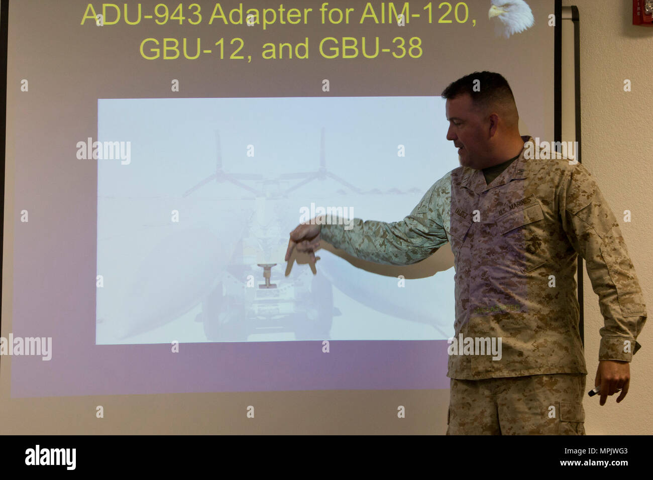 U.S. Marine Corps Capt. John P. Valdez, ordnance officer with Marine Aviation Weapons and Tactics Squadron One (MAWTS-1) gives a period of instruction on expeditionary ordnance during the first ever Aircraft Maintenance Officer Course (AAMOC) at Marine Corps Air Station Yuma, Ariz., March 17, 2017. AAMOC will empower Aircraft Maintenance Officers with leadership tools, greater technical knowledge, and standardized practices through rigorous academics and hands on training in order to decrease ground related mishaps and increase sortie generation. (U.S. Marine Corps photo taken by Cpl. AaronJam Stock Photo