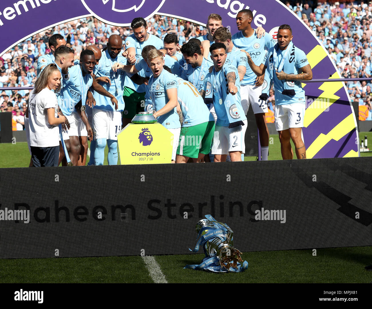 The Premier League trophy takes a tumble as Manchester City's Alexander