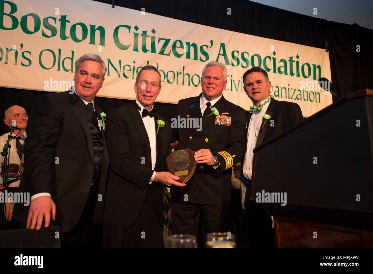 170317-N-WS581- 258    BOSTON (March 17, 2017) USNS Comfort (T-AH 20) Commanding Officer, Capt. Lanny Boswell, presents a gift to the South Boston Citizen’s Association at their Evacuation Day Banquet. Comfort participated in festivities and community programs throughout the city as part of Boston's St. Patrick’s Day celebration. (U.S. Navy photo by Mass Communication Specialist Andrew J. Sneeringer) Stock Photo
