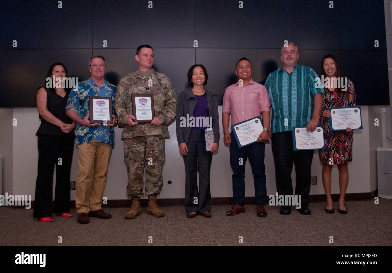 SCHOFIELD BARRACKS — From left to right: Sheryl Ferido, Community Services Manager, Island Palm Communities; Thomas Adams, Vice President / Regional Director of Property Management Island Palm Communities; Capt. Jed Warnock, Directorate of Emergency Services; Yanyan Huang, 25th ID; Jerry Pasamonte, 8th Theater Sustainment Command; Clyde Rockett, 8th TSC; and Melanie Streifel, 25th ID. U.S. Army Garrison-Hawaii was selected as a national award winner for its outstanding participation in the 33rd Annual National Night Out. This year’s campaign involved more than 38 million neighbors across 16,00 Stock Photo