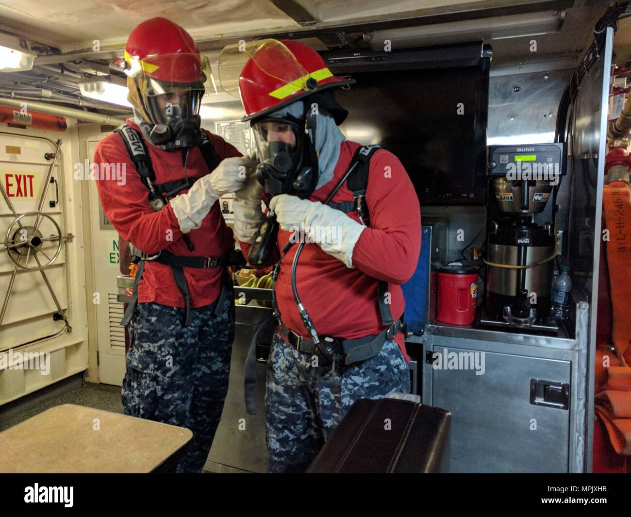 U.S. Naval Sea Cadet Corps cadets prepare to conduct firefighting training aboard the Coast Guard Cutter Galveston Island (WPB 1349) off of Honolulu, March 11, 2017. The USNSCC is a Navy-based organization, which serves to teach teens about sea-going military services, U.S. naval operations and training, community service, discipline and teamwork. (U.S. Coast Guard photo by Petty Officer 1st Class Joe Jorgenson/Released) Stock Photo