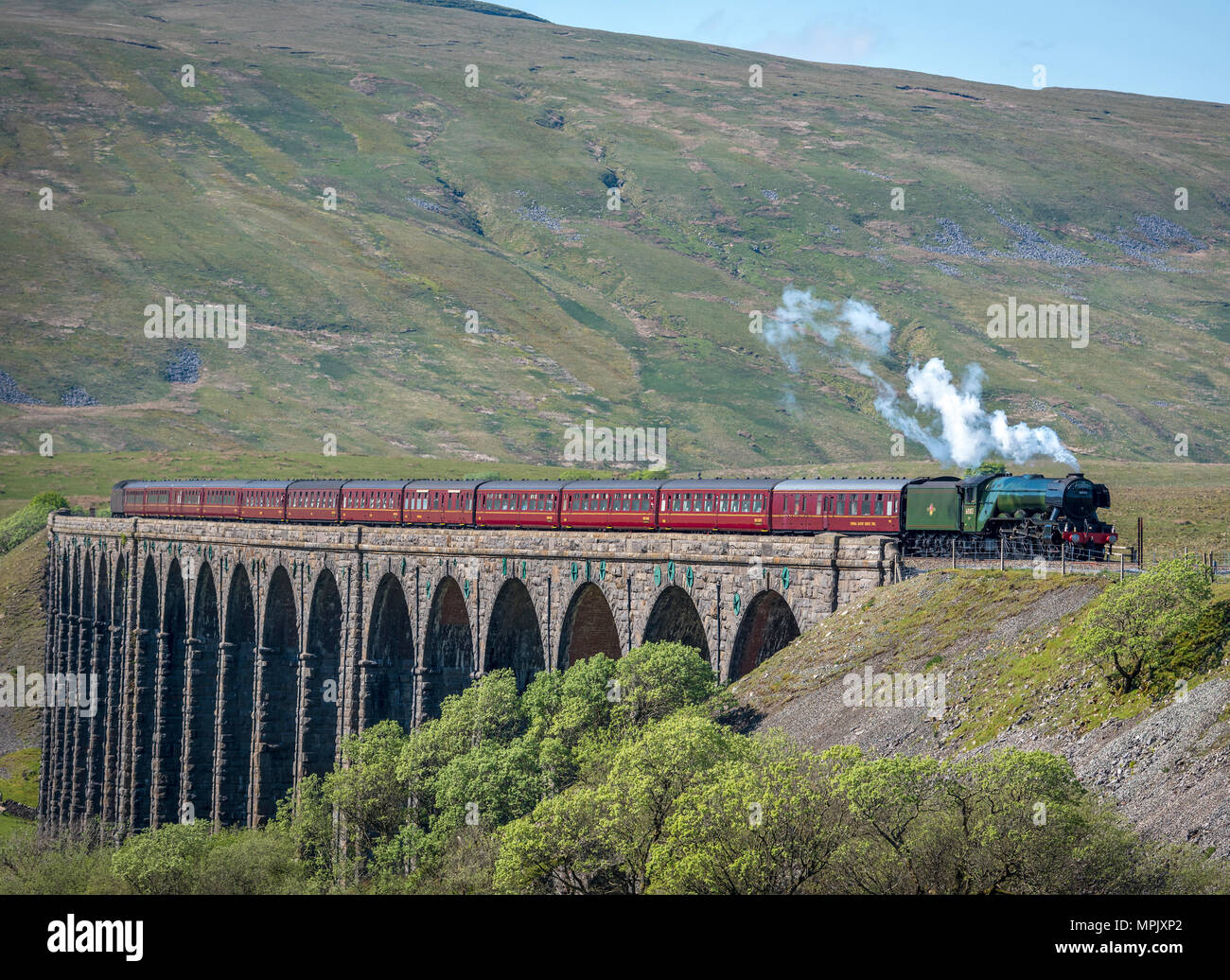 Ribblehead. United Kingdom.  22nd May. 2018. The world’s most famous steam locomotive, Flying Scotsman seen crossing the Ribblehead Viaduct hauling Da Stock Photo