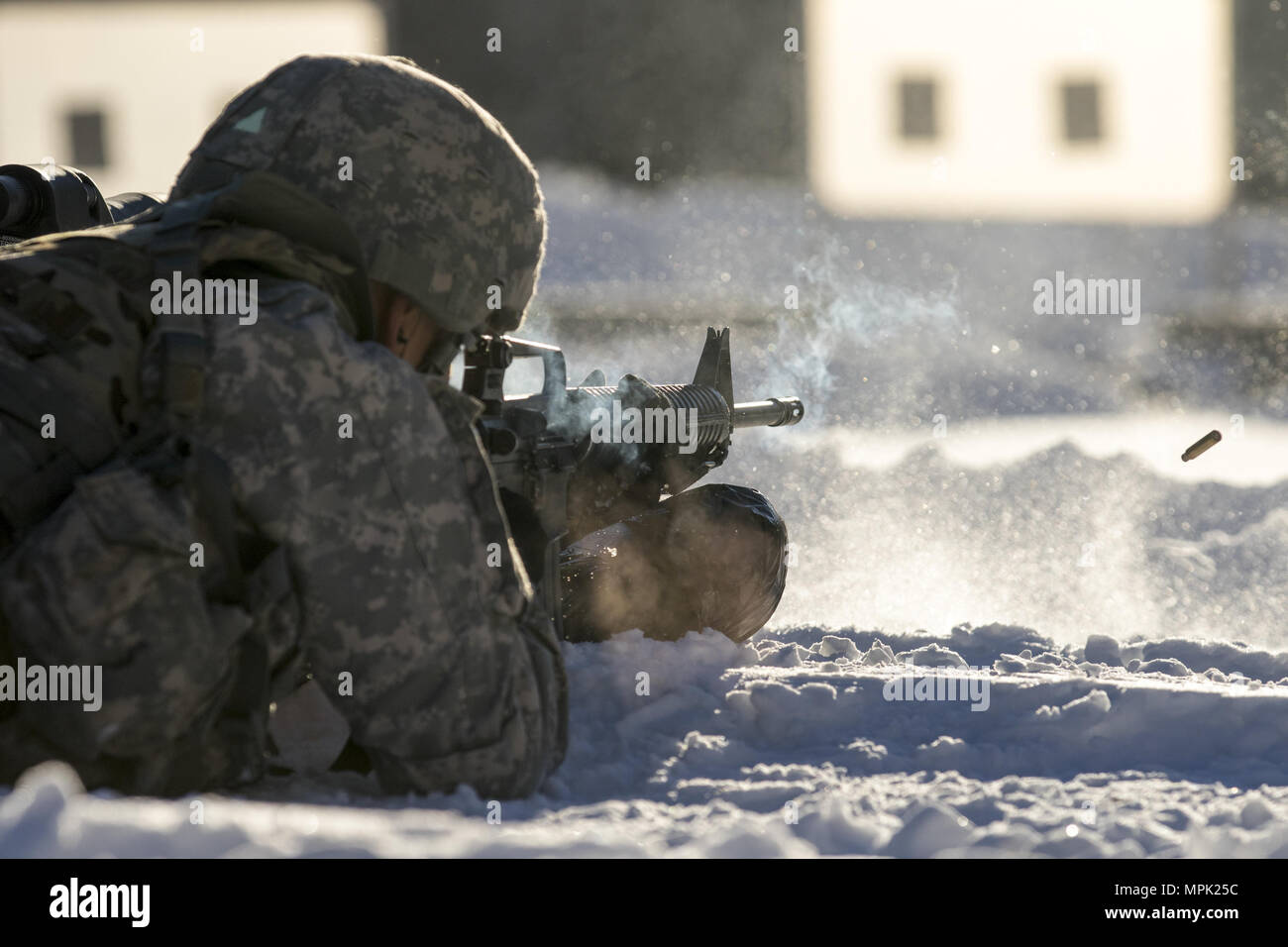 U.S. Army Spc. Saul Hernandez, infantryman, Alpha Company, 3rd Battalion, 172nd Infantry Regiment, 86th Infantry Brigade Combat Team (Mountain), Vermont National Guard, qualifies on a M16A2 rifle during the Vermont Best Warrior Competition at Camp Ethan Allen Training Site, Jericho, Vt., March 17, 2017.  During the three-day Best Warrior Competition, elite soldiers selected by their units are tested by board interviews, physical fitness tests, written exams, and warrior tasks relevant to today’s operating environment.  (U.S. Army National Guard Photo by 1s Lt. Benjamin Haulenbeek) Stock Photo