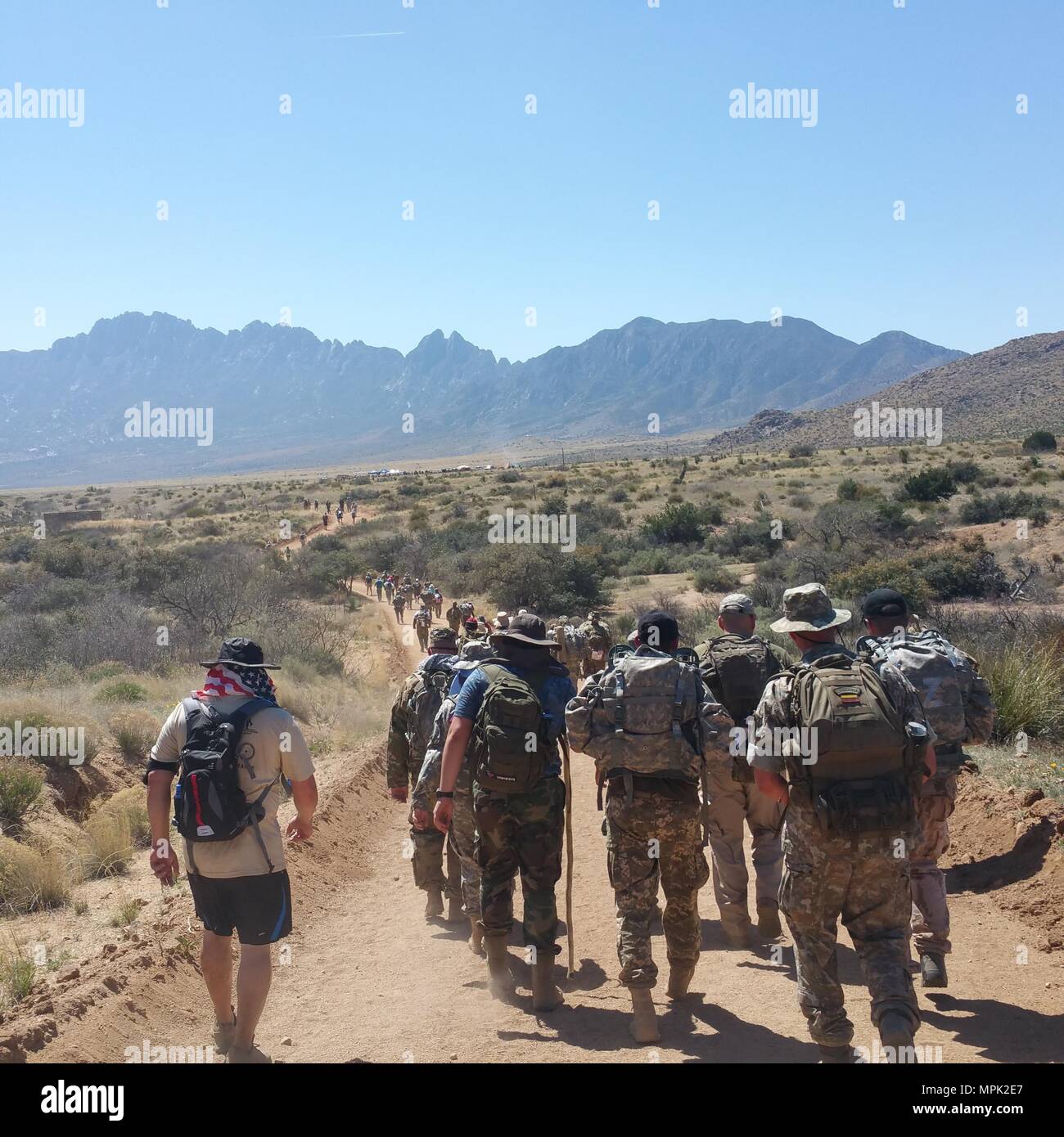 Participants in the Bataan Memorial Death March trek through the desert