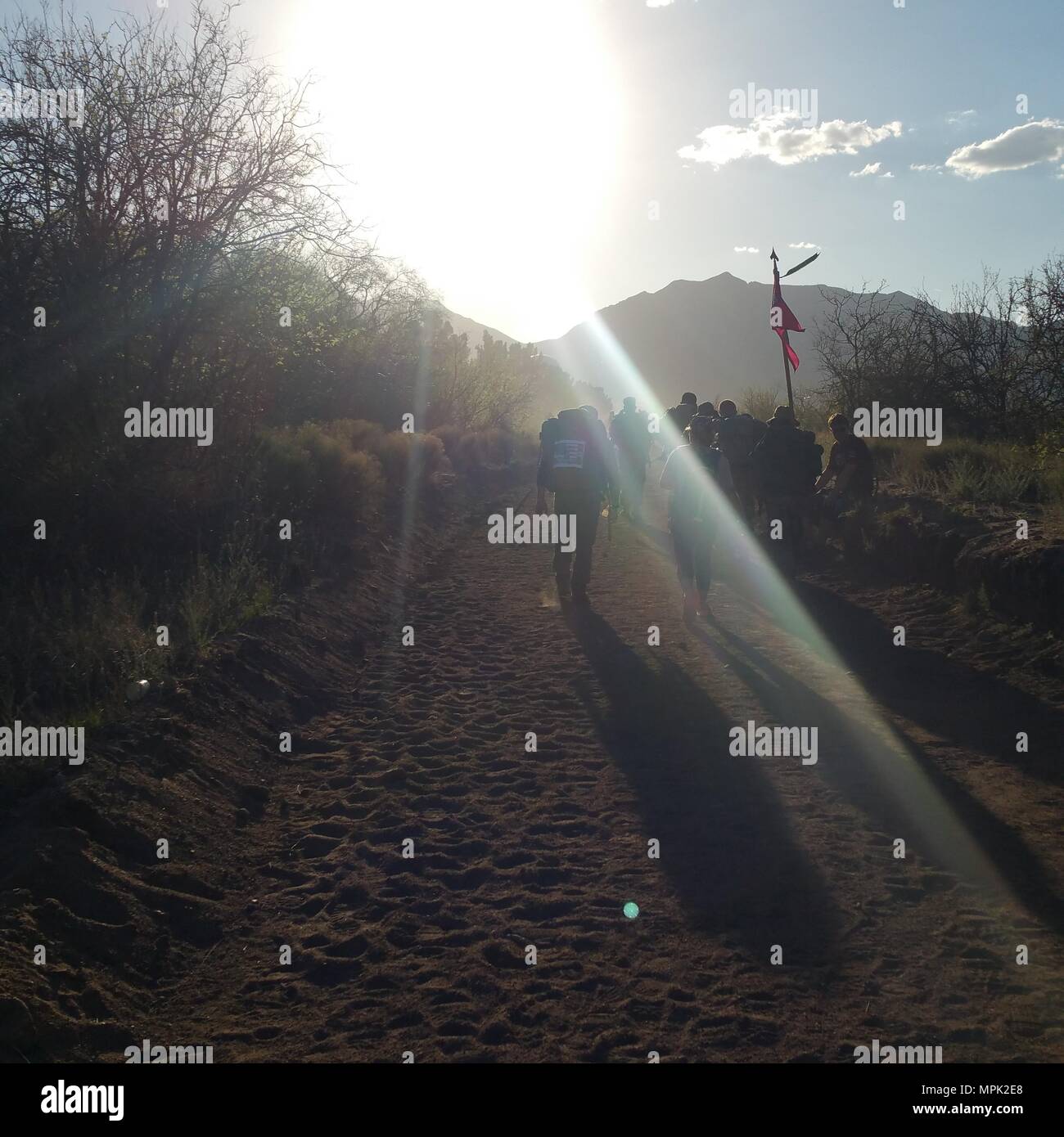 Participants in the Bataan Memorial Death March trek through the desert