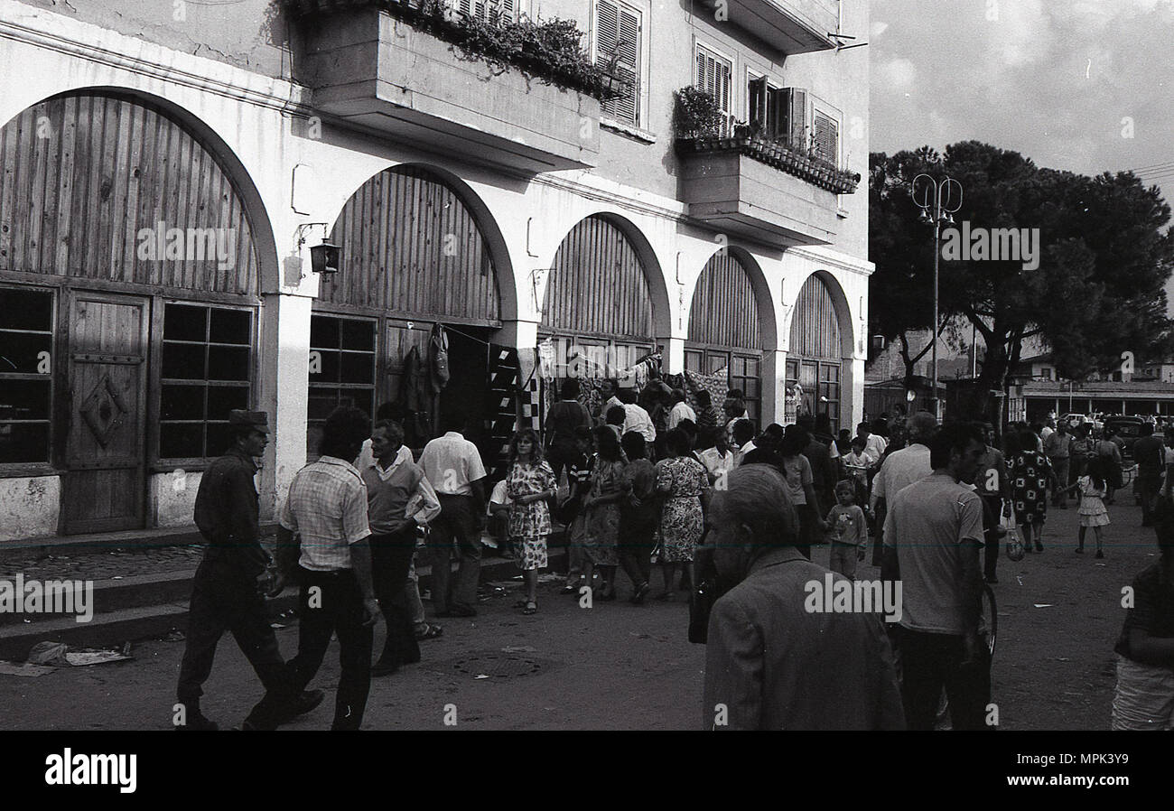 GROUP OF PEOPLE CONGREGATING NEAR BUILDING Stock Photo - Alamy