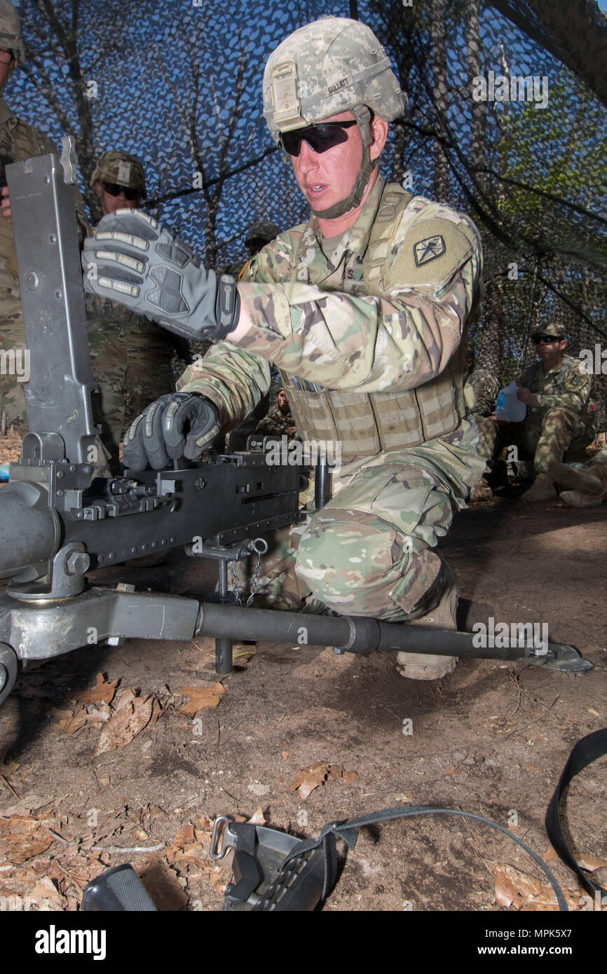 A Soldier performs a functions check on an M2HB Browning .50 caliber heavy  machine gun at Fort Jackson during Expert Infantryman Badge (EIB) training  on March 23. The exercise evaluates weapon function,