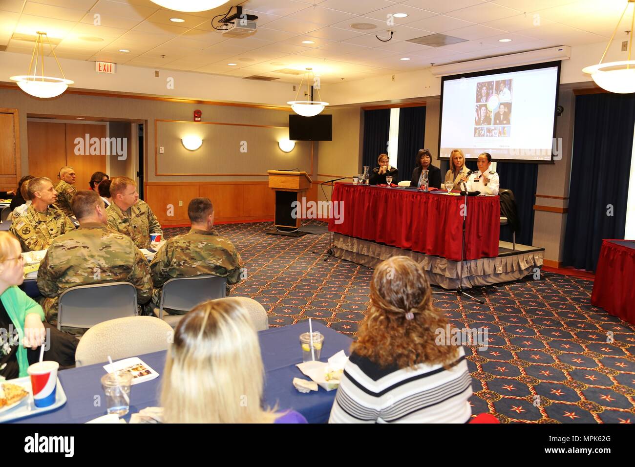 A guest speaker panel comprising (left to right) Capt. Kimberly