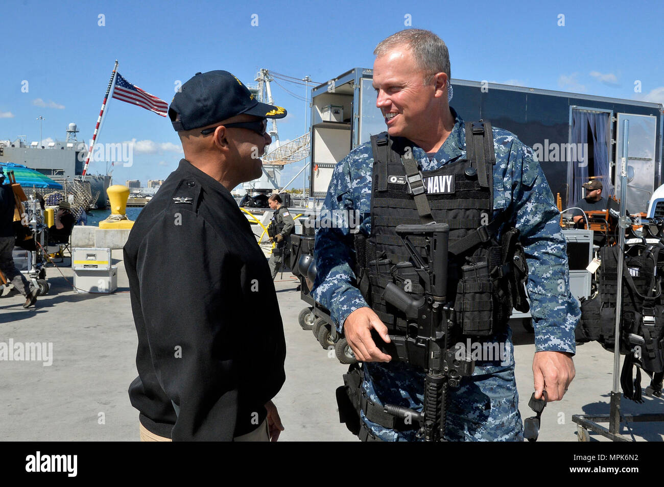 170323-N-IE405-021 SAN DIEGO (March 23, 2017) Naval Base San Diego Commanding Officer Capt. Roy Love greets actor Adam Baldwin prior to the filming of the television show 'The Last Ship' on board the guided (U.S. Navy photo by Mass Communication Specialist 2nd Class Indra Bosko/Released) Stock Photo