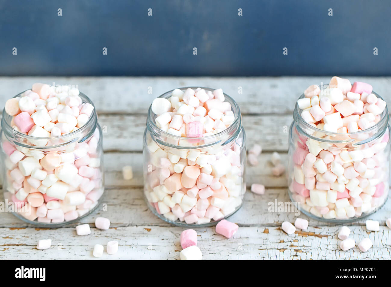 Three glass jars filled to the brim marshmallow Stock Photo Alamy