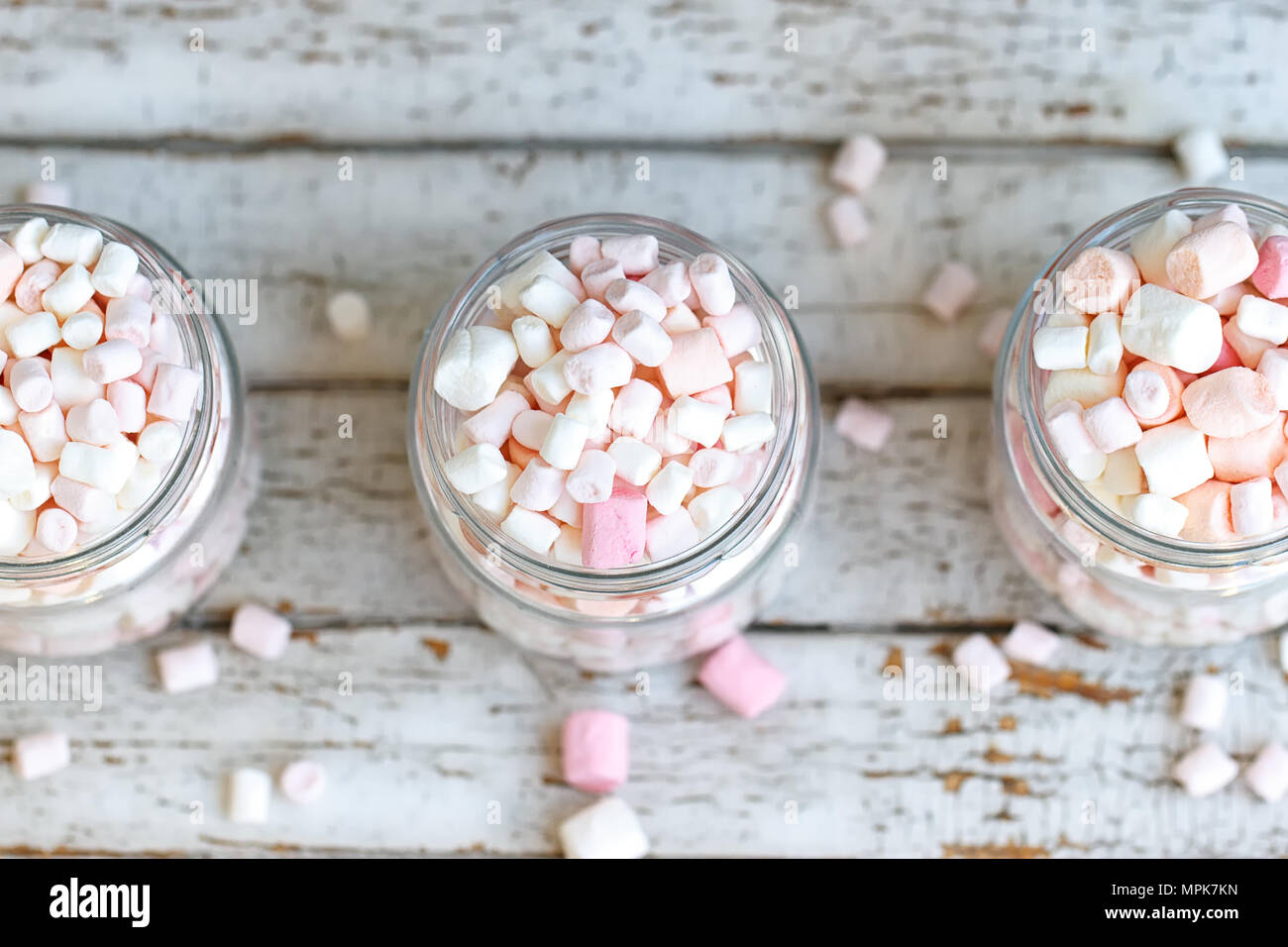 Three glass jars filled to the brim marshmallow Stock Photo Alamy