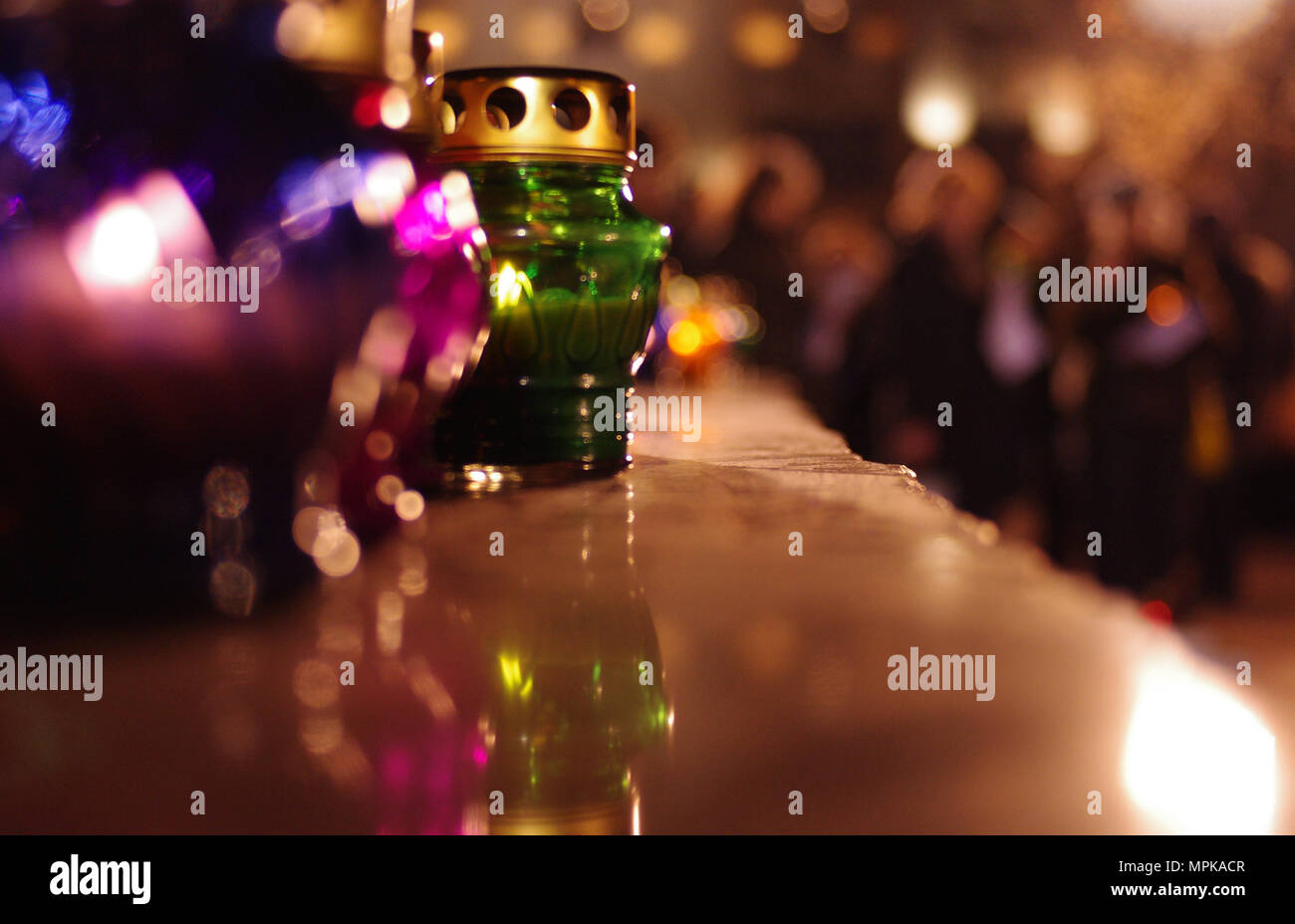 Colored candle lanterns on a stone pedestal Stock Photo Alamy