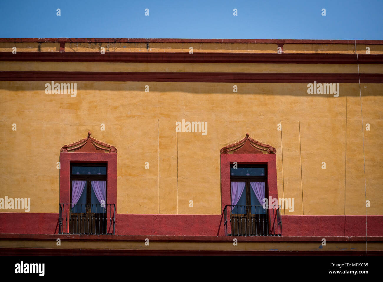 Historical house with two windows, Queretaro  city in Central Mexico Stock Photo