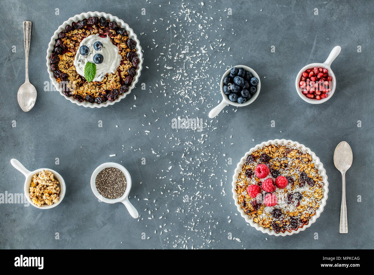 Top view of raw food diet vegan tarts with nuts, seeds and berries