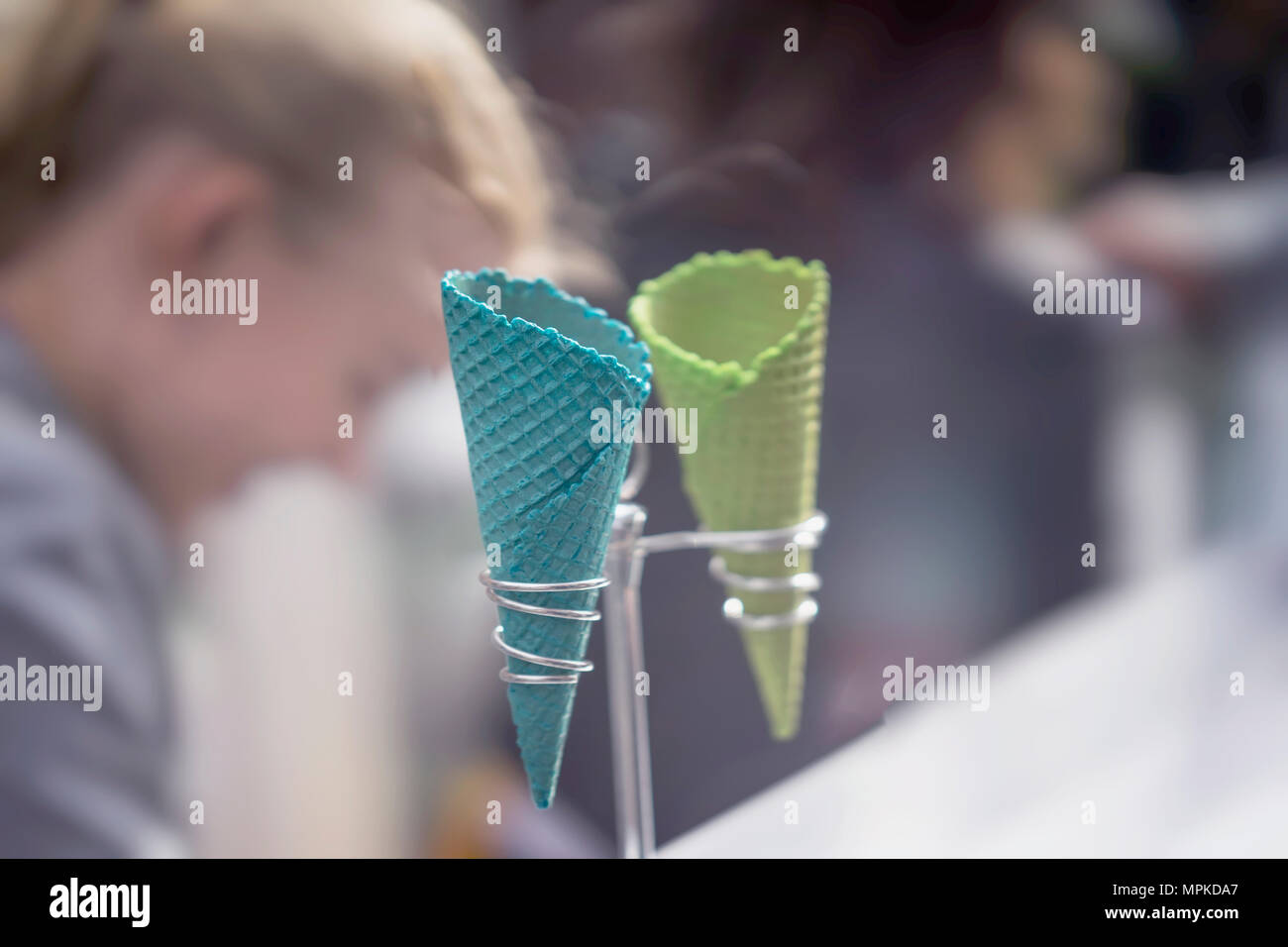 Light background with two empty bright wafer for ice cream on