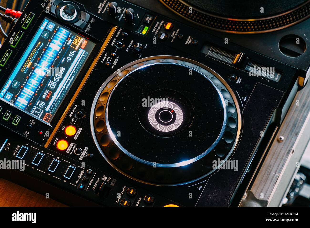 DJ Equipment Deck With Music Track Control And Mixer At Club Night