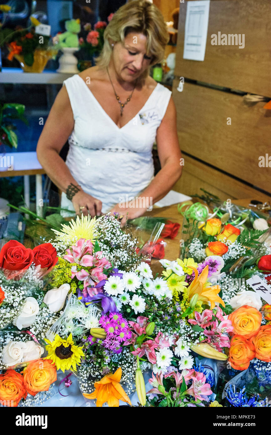 Montreal Canada,Quebec Province,Trudeau International Airport,woman female women,florist,flower,flower,bouquets,Fleuriste de l'Aeroport,Canada07070301 Stock Photo
