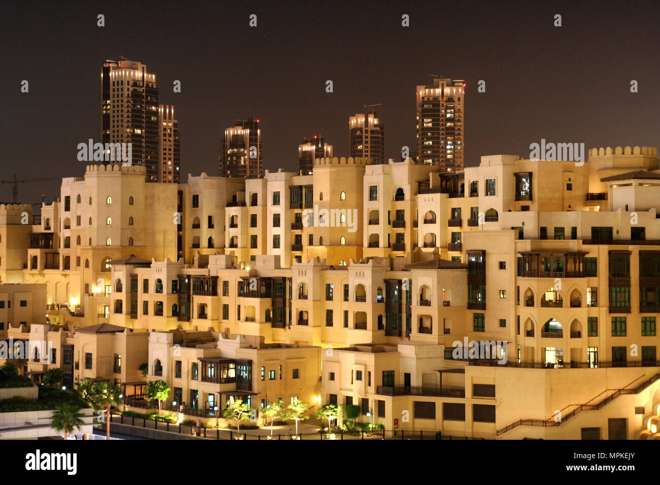 Houses and highrise in the Dubai city centre at night. Stock Photo