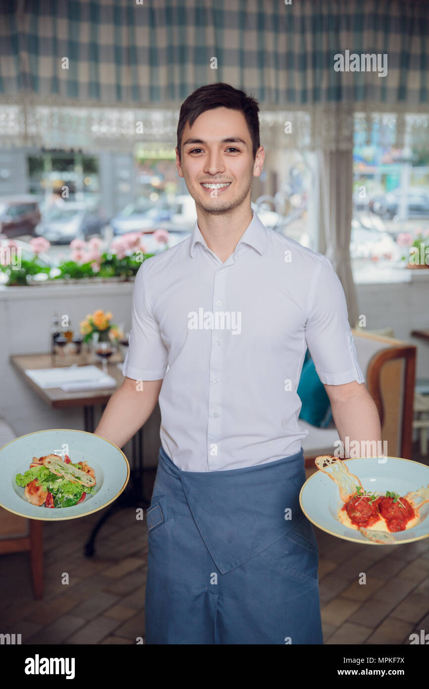 Waiter Carrying Plates With Dish On Some Festive Event Party Or