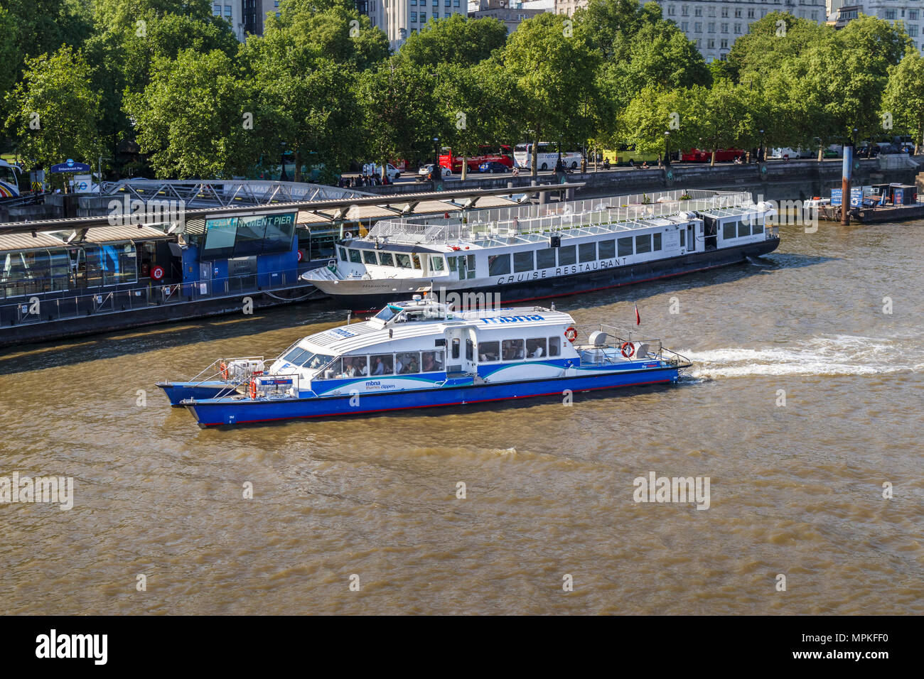 MBMA Thames Clipper riverbus 'Sky Clipper' approaching Embankment Pier on the north side of the River Thames, London, UK Stock Photo