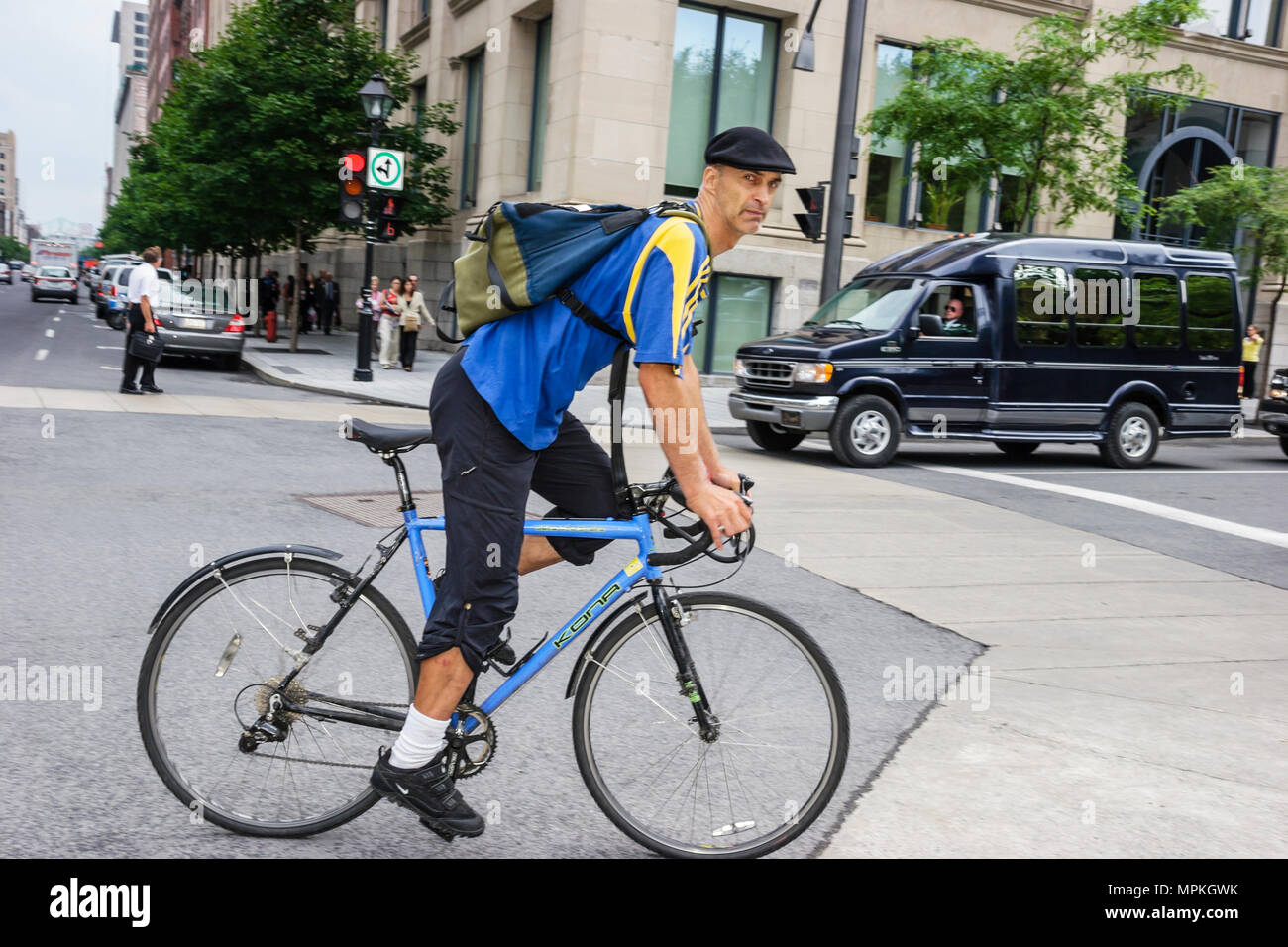 Montreal Canada,Quebec Province,Victoria Square,adult adults man men male, bicycle,bicycling,riding,biking,rider,bike messenger,chapeau,hat,backpack,vi  Stock Photo - Alamy