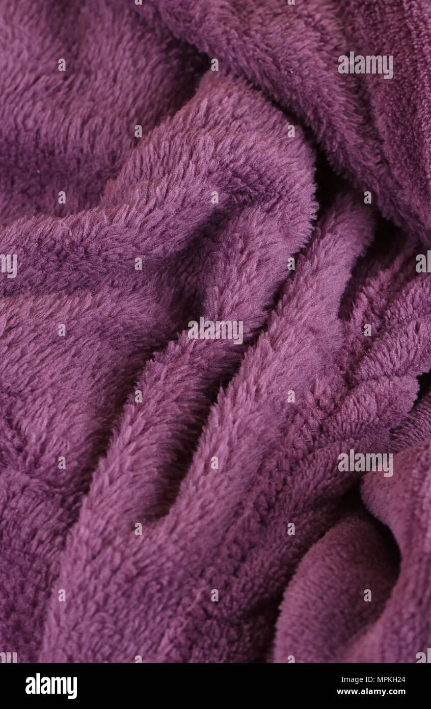 Dark purple bath fluffy towel or blanket Stock Photo - Alamy