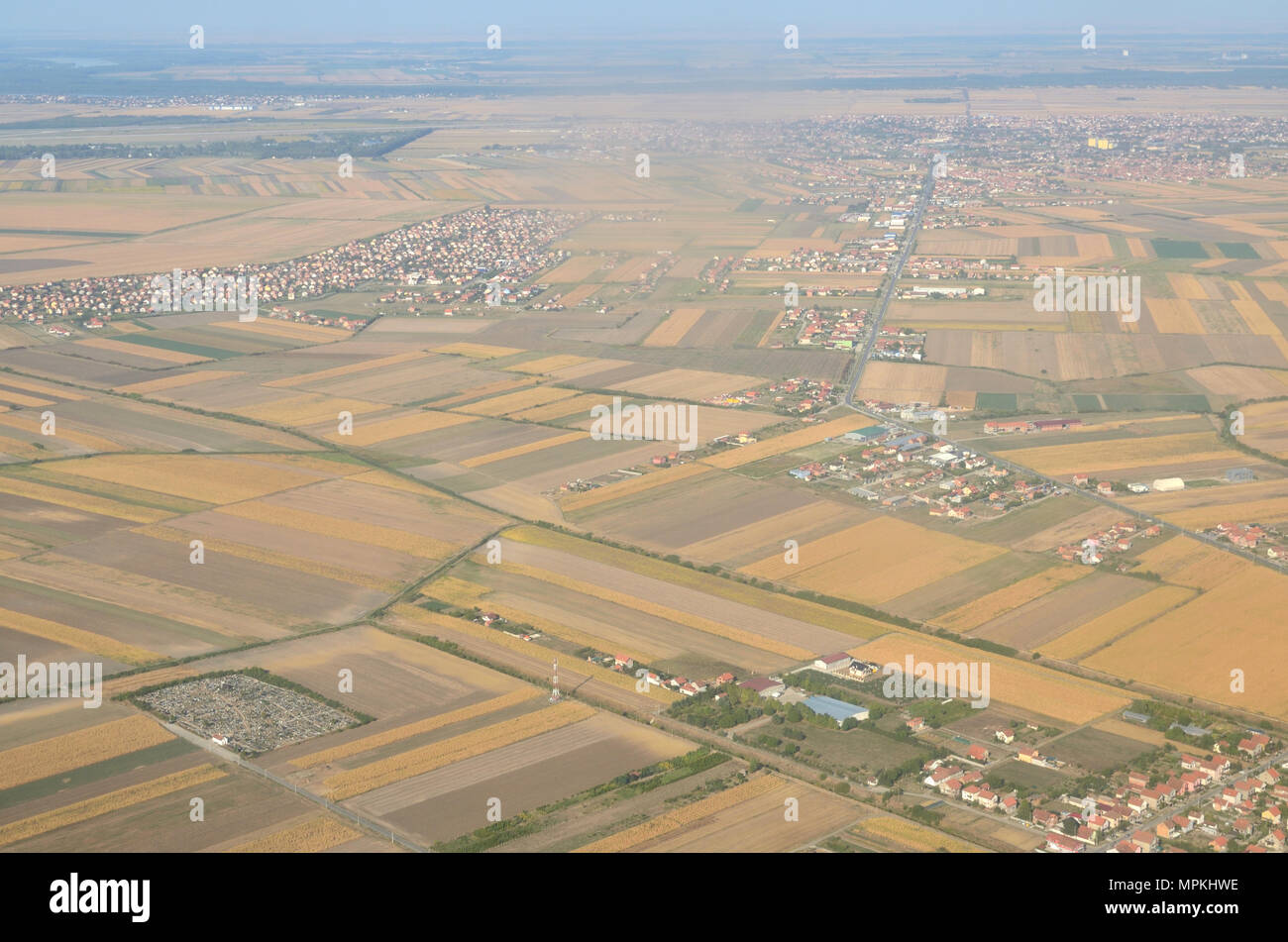 Plains with different plants and a city suburb seen from the air - Belgrade, Serbia Stock Photo