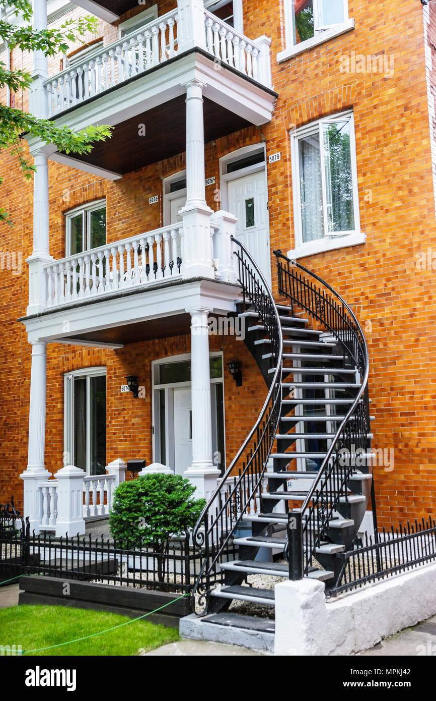 Montreal Canada,Quebec Province,Rue Fabre,three 3 story condominium,residential,apartment,apartments,flat,building,traditional curved staircase,porch, Stock Photo
