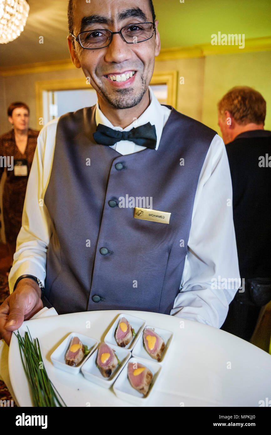 Montreal Canada,Quebec Province,Fairmont Queen Elizabeth,hotel,Mideastern man,male waiter,server,hors d'oeuvres reception,food,hospitality,Canada07070 Stock Photo