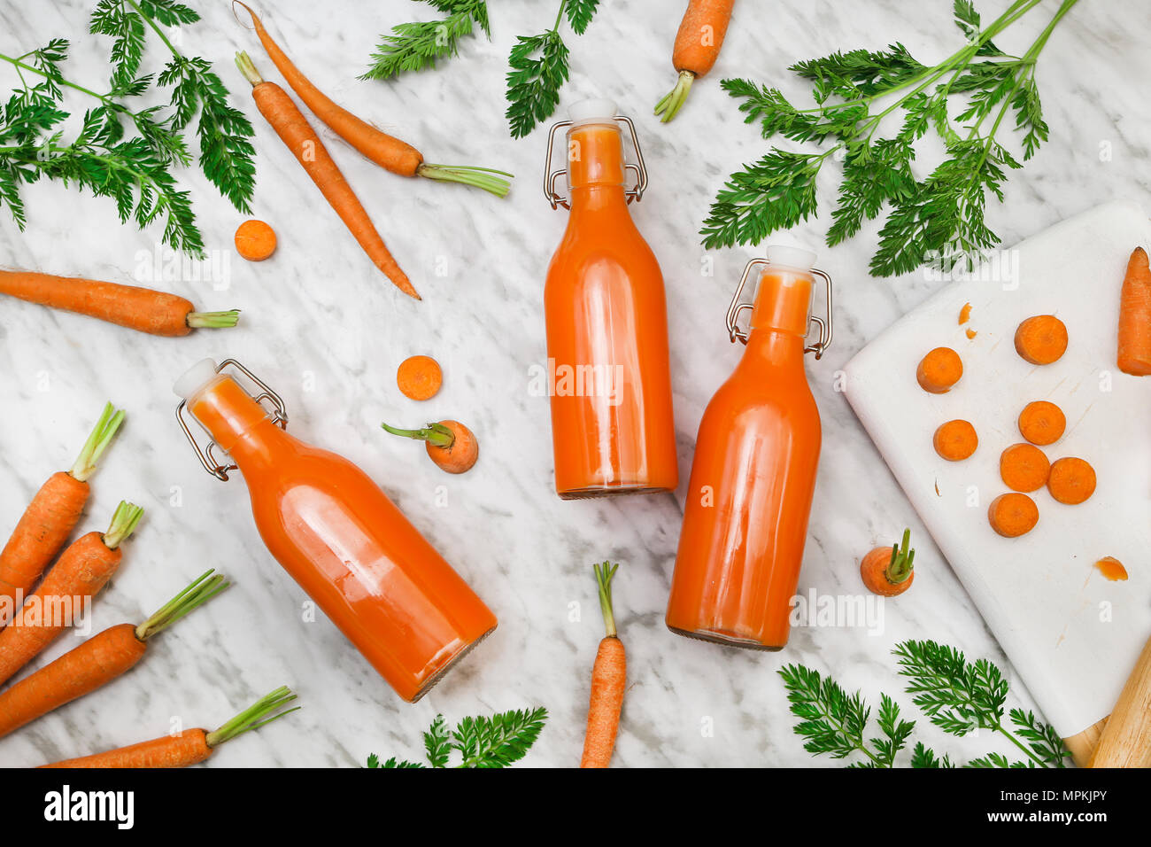 Homemade carrot juice in bottles Stock Photo