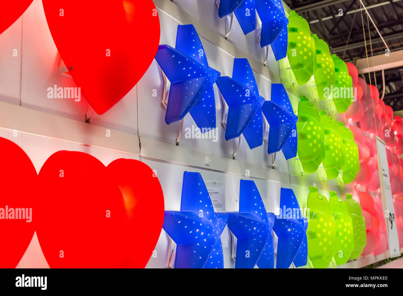 Bright colorful wall lamps for sale inside an Ikea store in the US Stock Photo