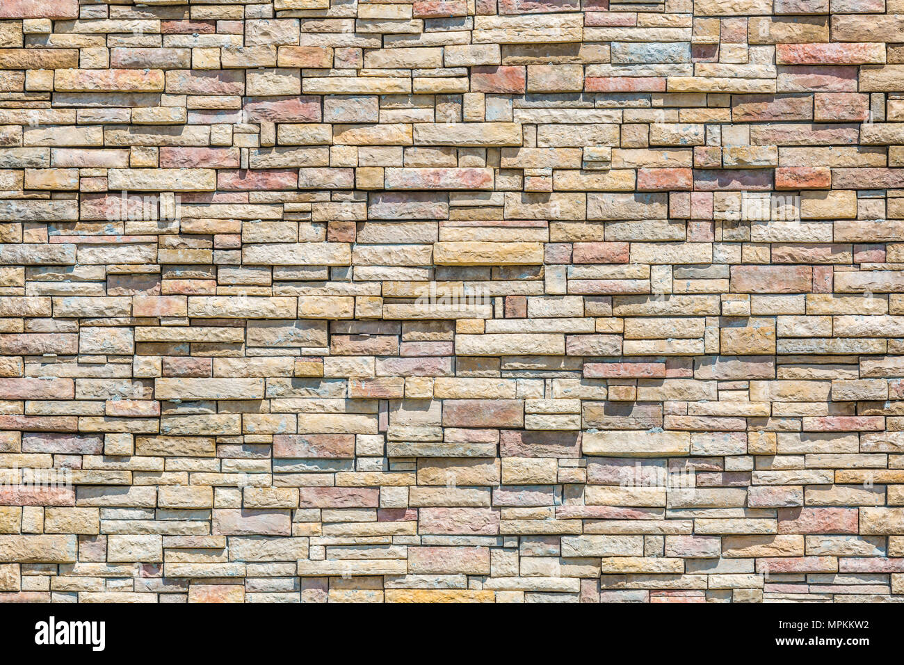 Stacked stone masonry wall Stock Photo
