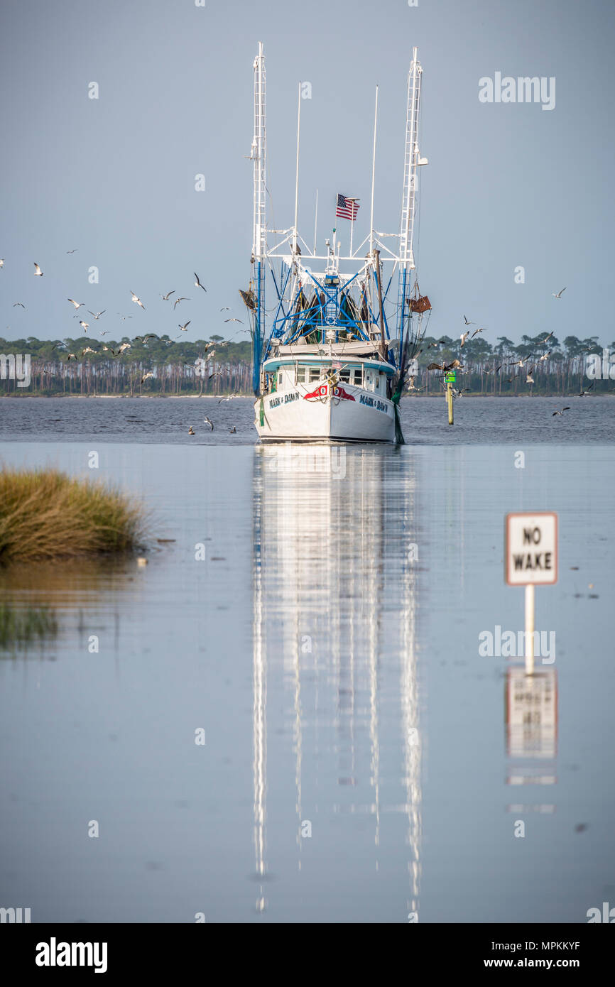 Shrimp boat entering port at Ocean Springs Harbor, Mississippi Stock