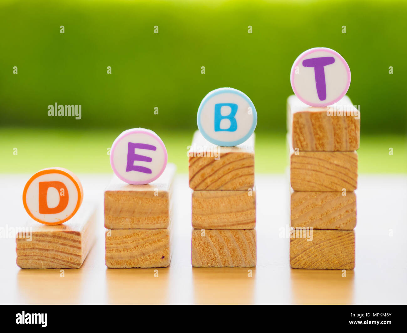Stack of wood in debt concept in debt concept Stock Photo Alamy