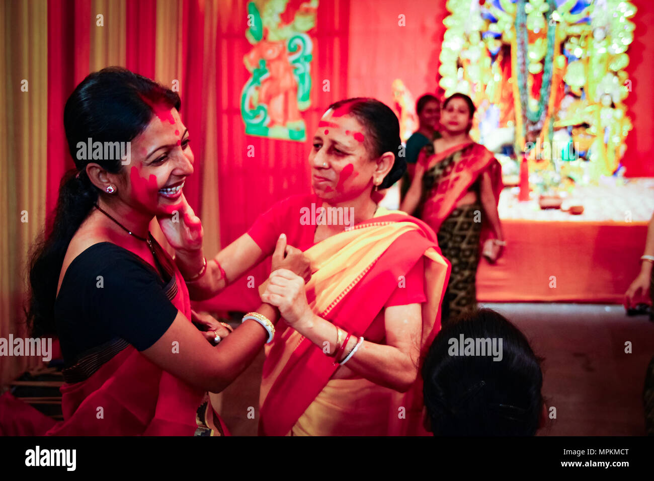 September, 2017,Kolkata,India. Two unidentified ladies playing vermilion sindur khela on the day of dashami. Stock Photo